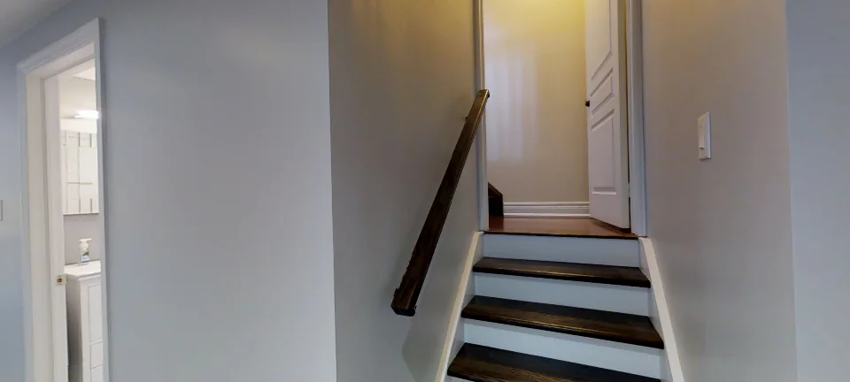 The staircase and the hallway, in a finished basement in Aurora by Harmony Basements, captured in 360 degrees