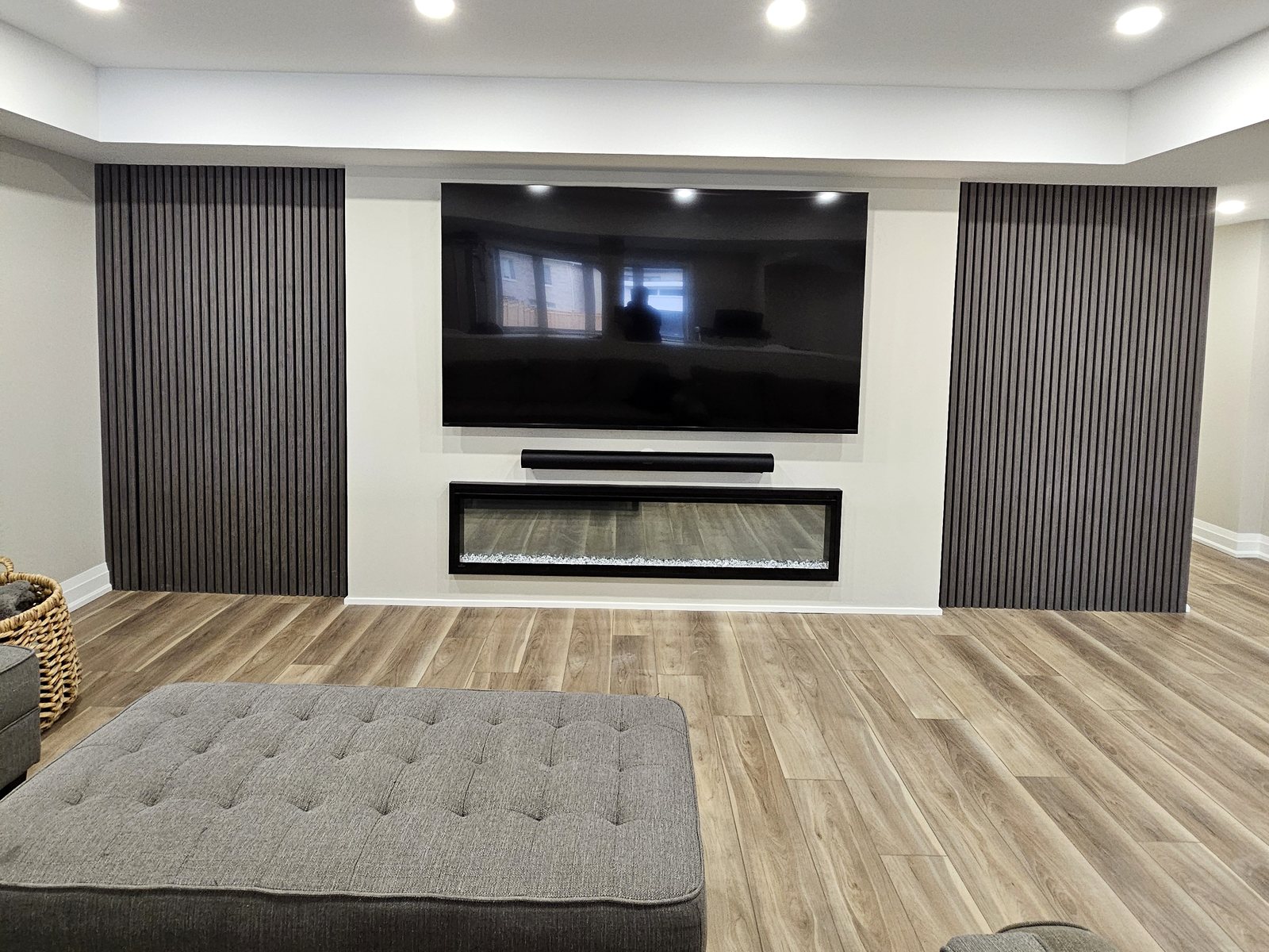 Basement idea, the lounge and media wall: a finished basement in East Gwillimbury by Harmony Basements