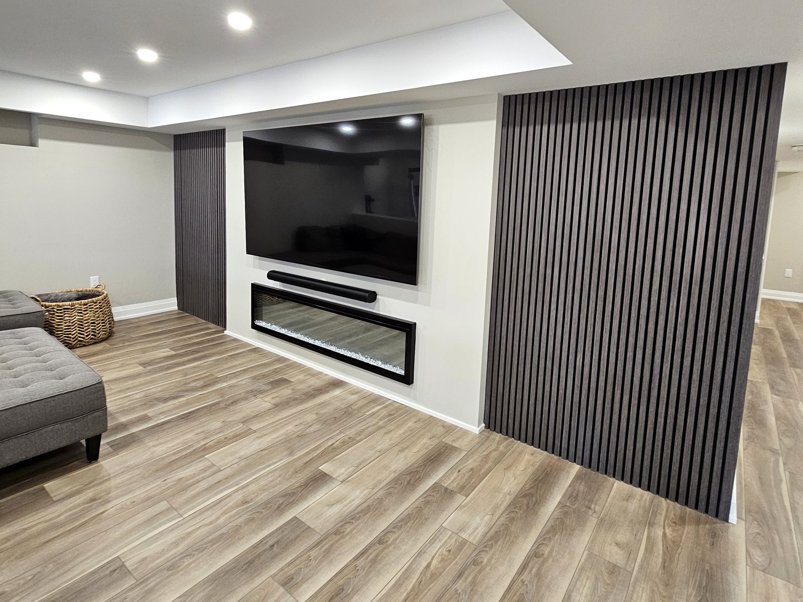 Basement idea, the lounge and media wall: a finished basement in East Gwillimbury by Harmony Basements