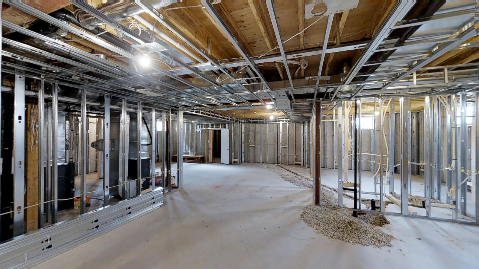 A Vaughan basement at rough-in: steel studs, wiring, ducting and plumbing in place before the insulation went on