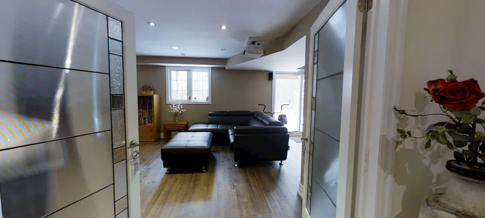 The hall and the frosted-glass doors, in a finished basement by Harmony Basements, captured in 360 degrees