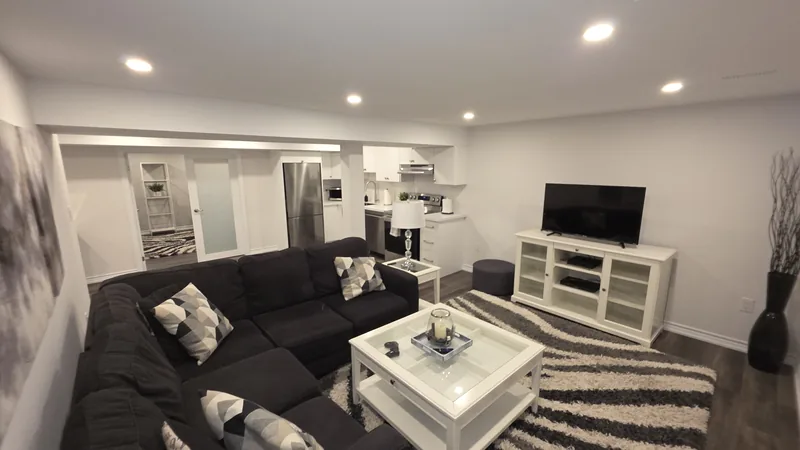 Basement finishing Orangeville: the living room and its TV wall — built in Woodbridge