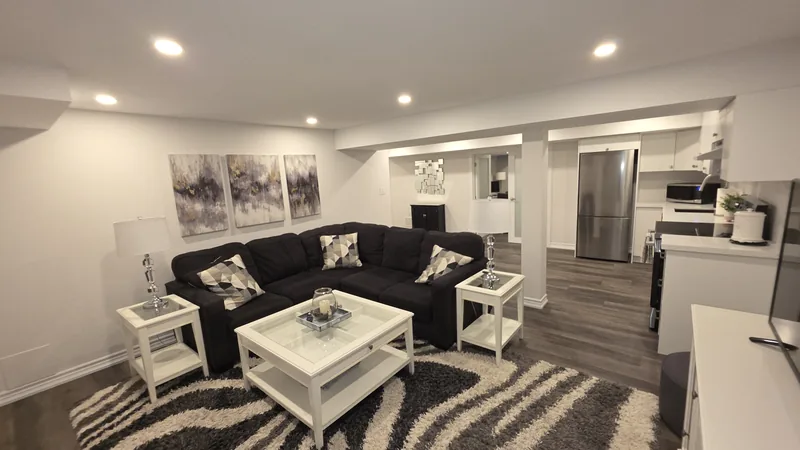 Finished basement Etobicoke: the family room, looking toward the kitchen — built in Woodbridge