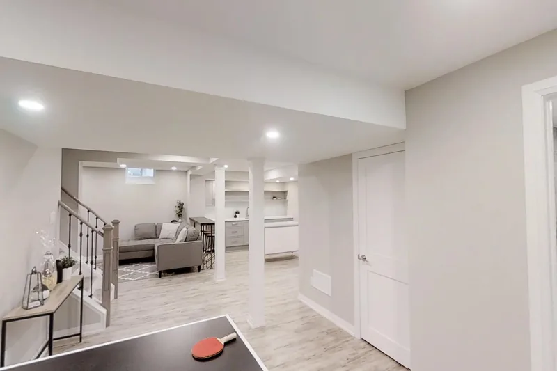 Basement renovation in Thornhill: the finished open-plan room, with the same basement walkable before the work, in the 3D tour