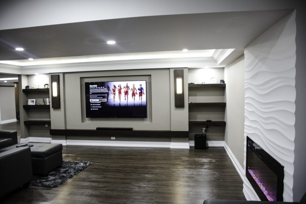 Basement idea, the ceiling and lighting: a finished basement in Toronto by Harmony Basements