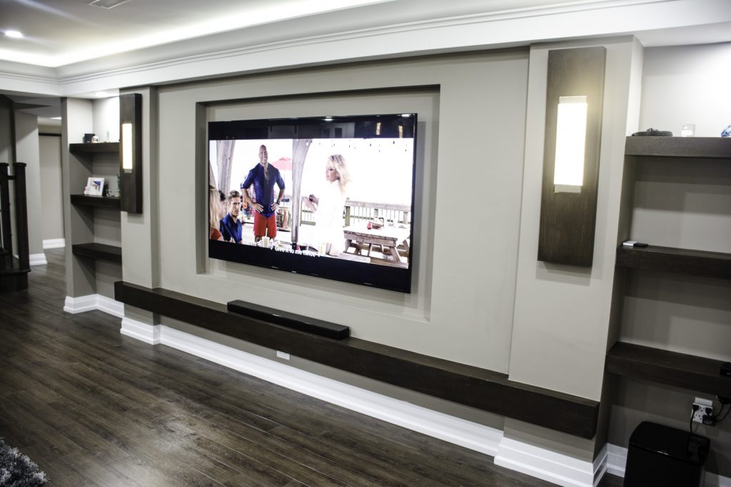 Basement idea, the lounge and media wall: a finished basement in Toronto by Harmony Basements