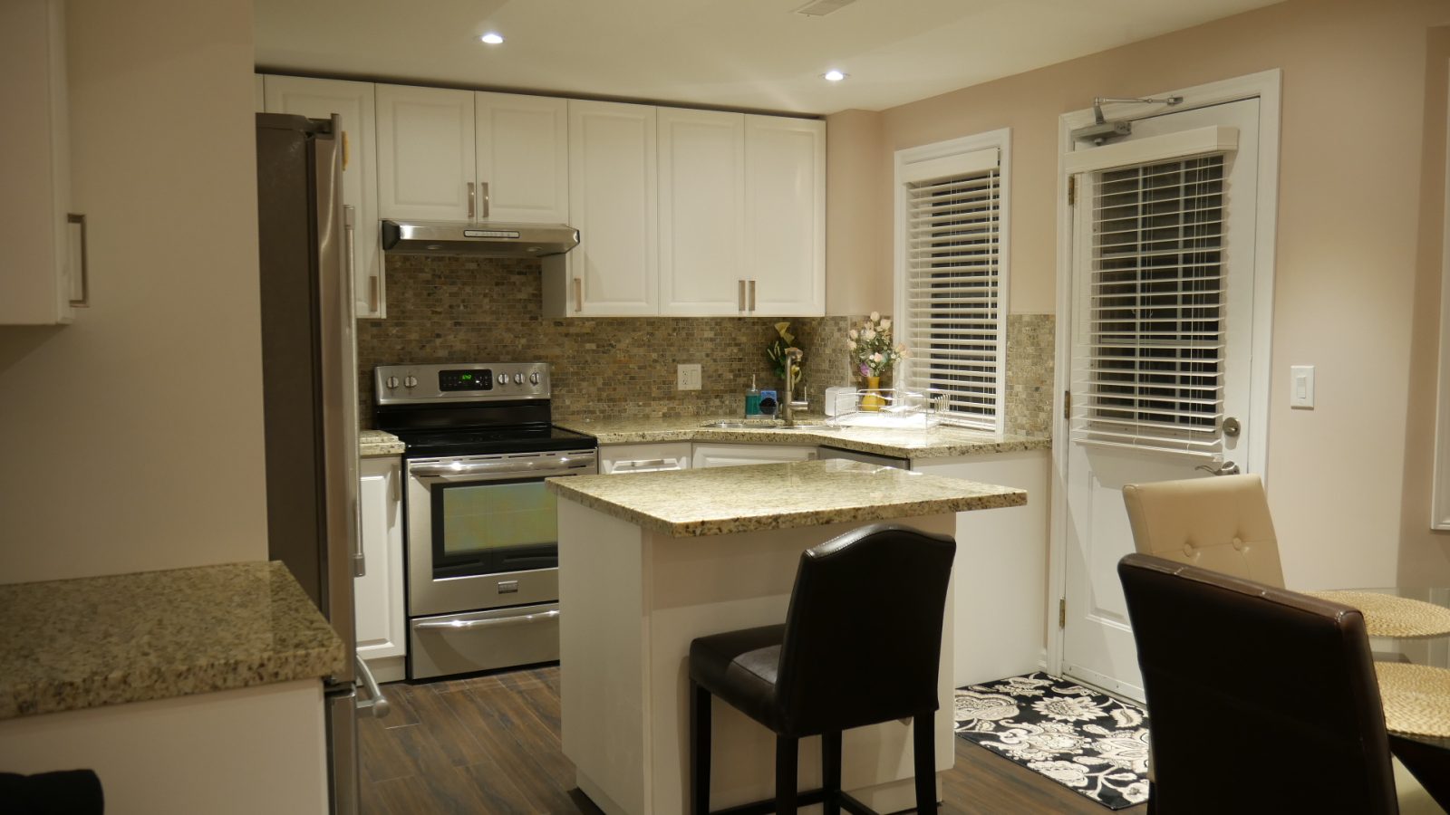 W, by Harmony Basementsalkout basement open space with small kitchen small island and dining room basement finishing near me innisfil