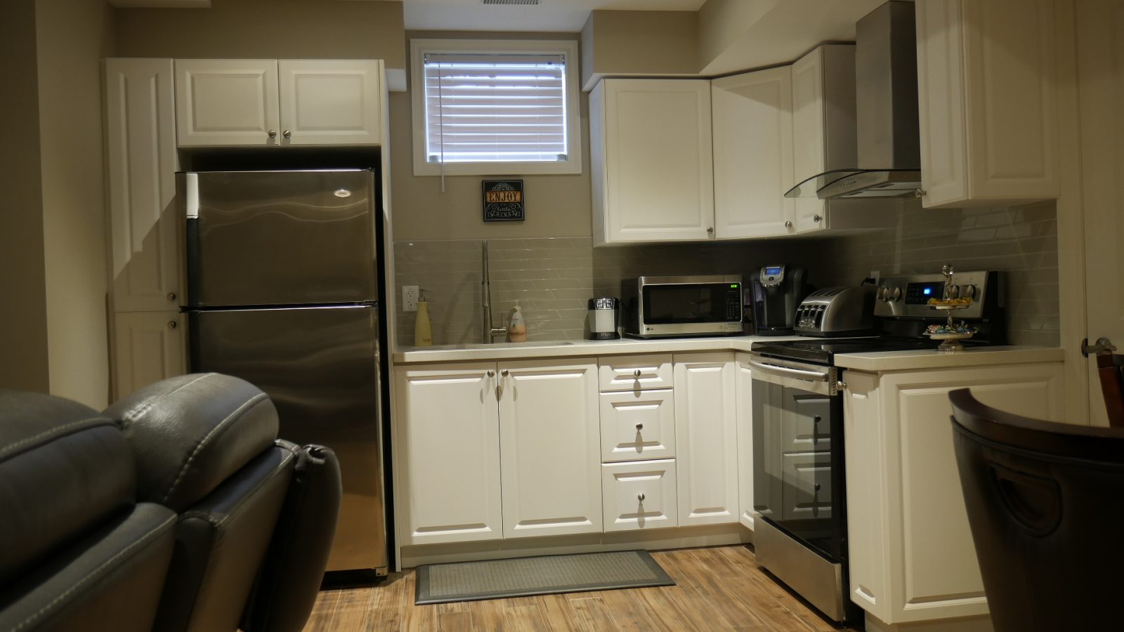 The kitchen in a finished basement in King City by Harmony Basements