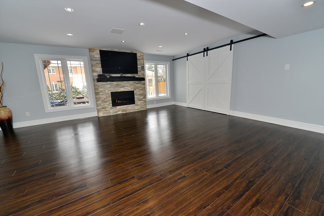 The family room in a finished basement in Aurora by Harmony Basements