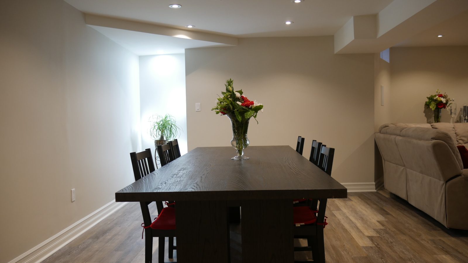 The dining area in a finished basement by Harmony Basements