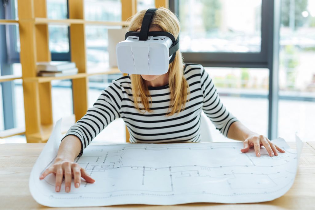 Reviewing a basement plan with a virtual reality headset