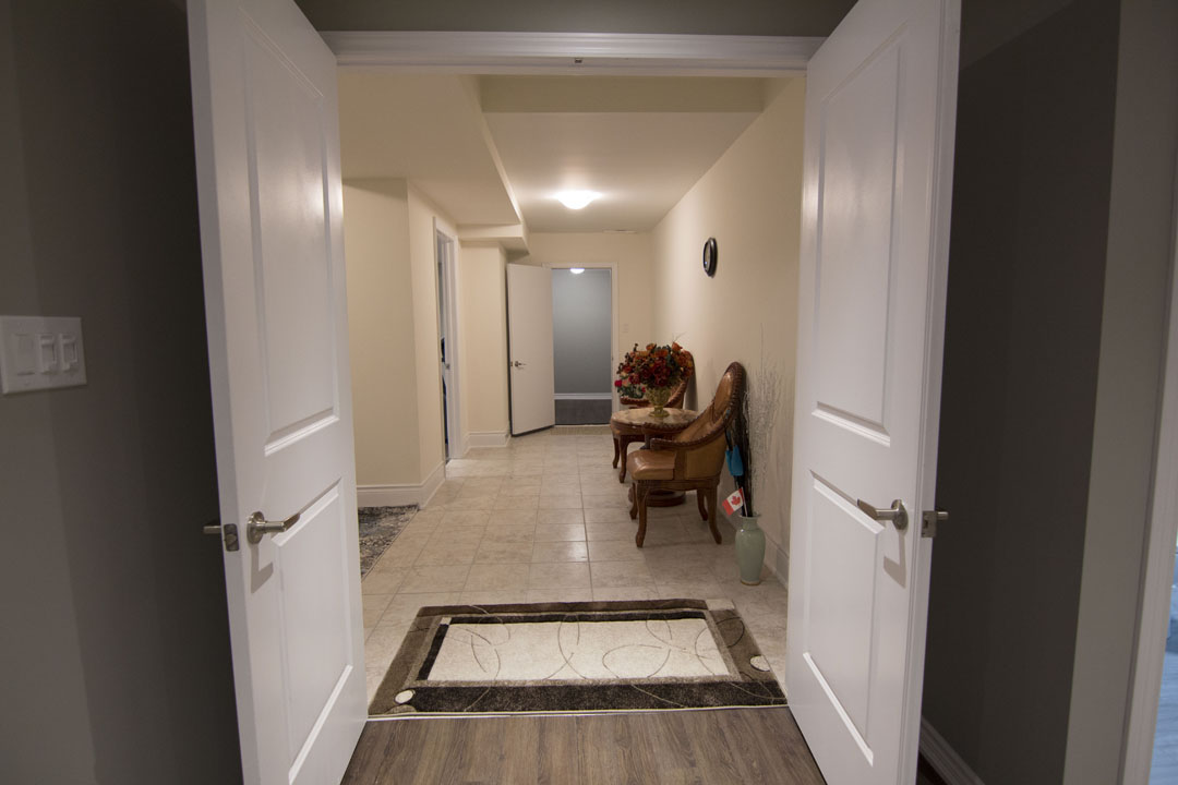 The hallway in a finished basement in Concord, Vaughan by Harmony Basements