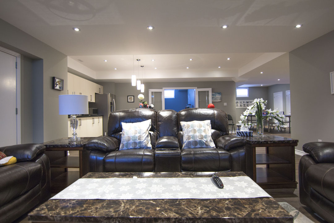The family room, towards the kitchen in a finished basement in Concord, Vaughan by Harmony Basements