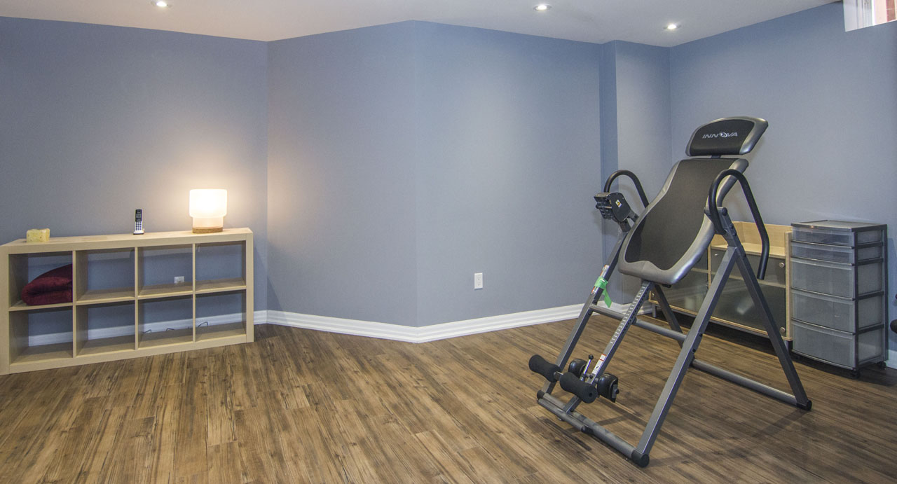 The gym corner in a finished basement in Maple by Harmony Basements