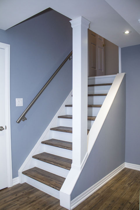 Basement idea, the stairs: a finished basement in Maple by Harmony Basements