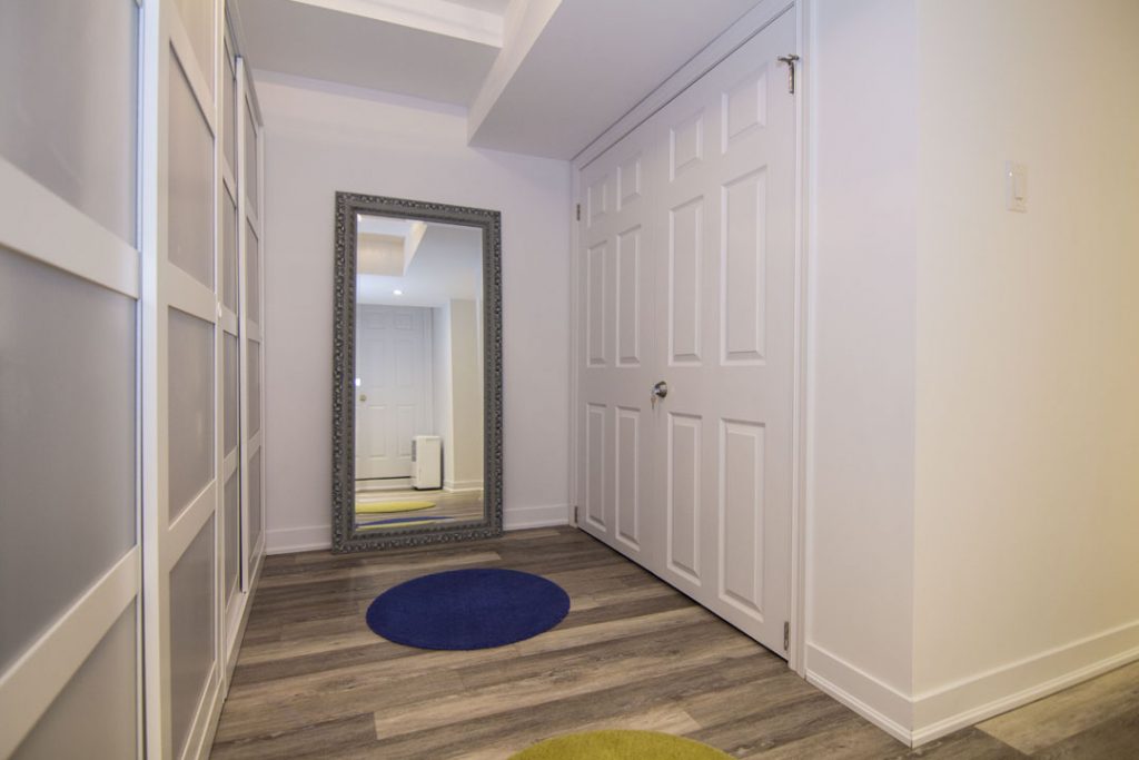 Basement idea, the built-in storage: a finished basement in Scarborough by Harmony Basements