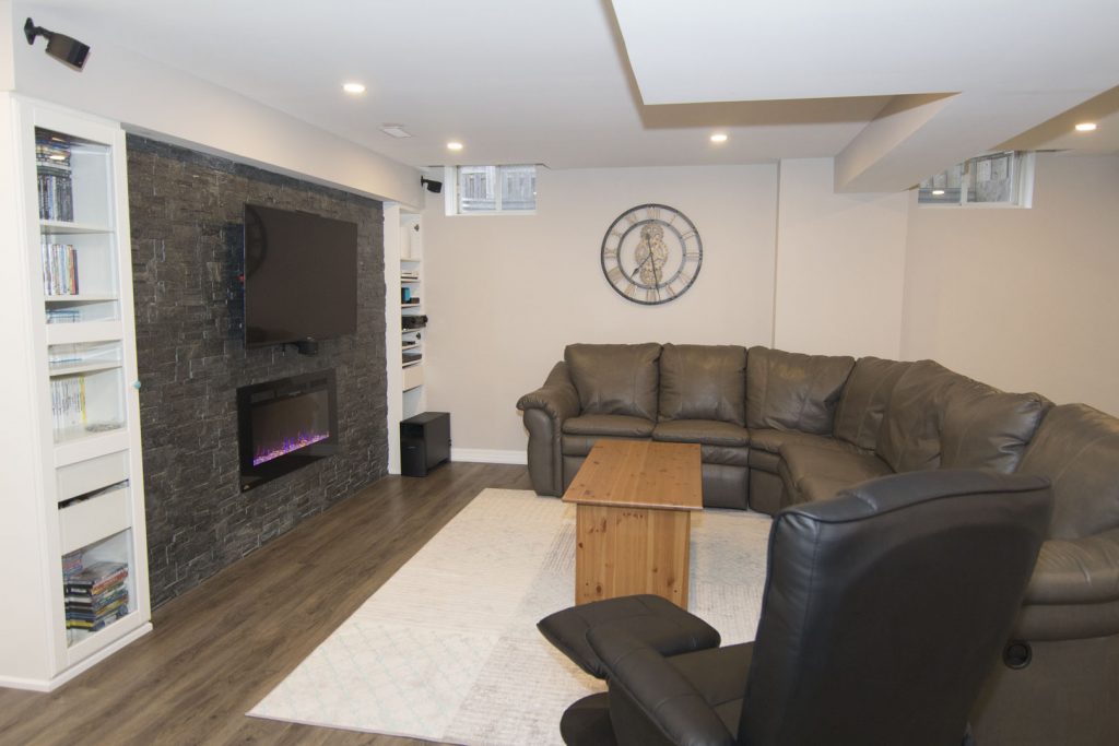 Finished Basement & Living Room by Harmony Basements