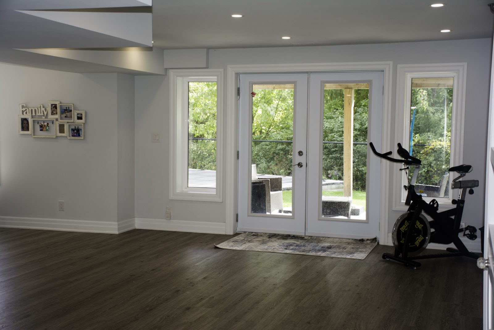 The walkout French doors in a finished basement in Oakville by Harmony Basements
