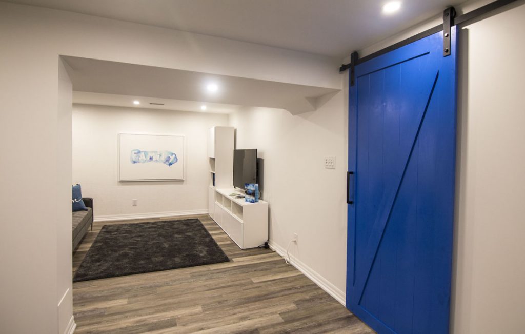 Basement Family Room with Blue Sliding Door - Basement Design Vaughan