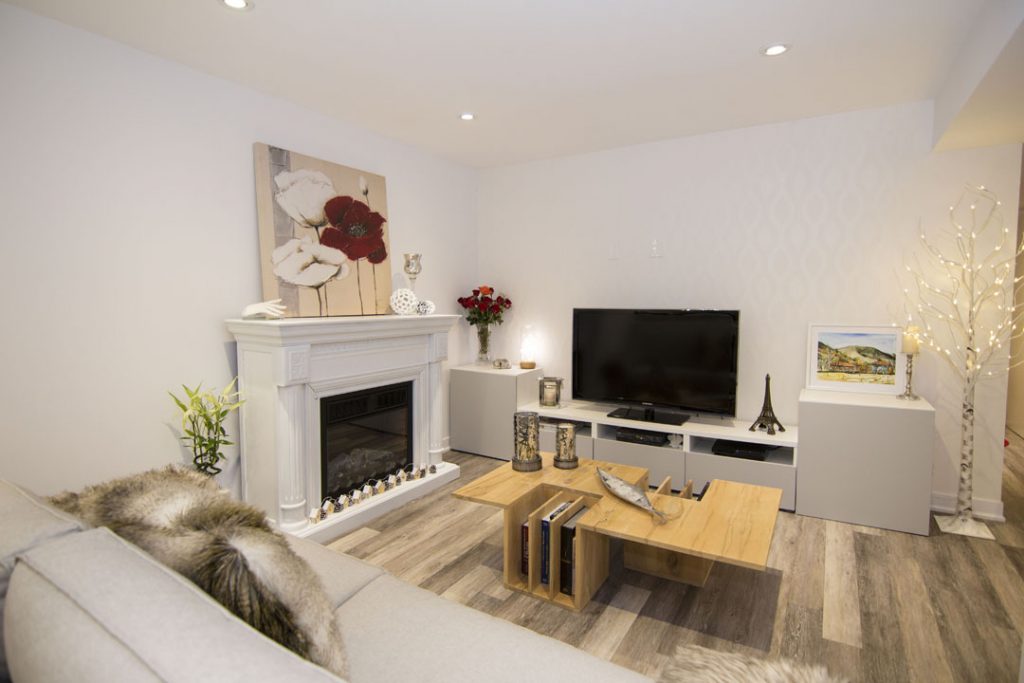 Build in Fireplace and Wall Unit in Basement Renovation Project Maple