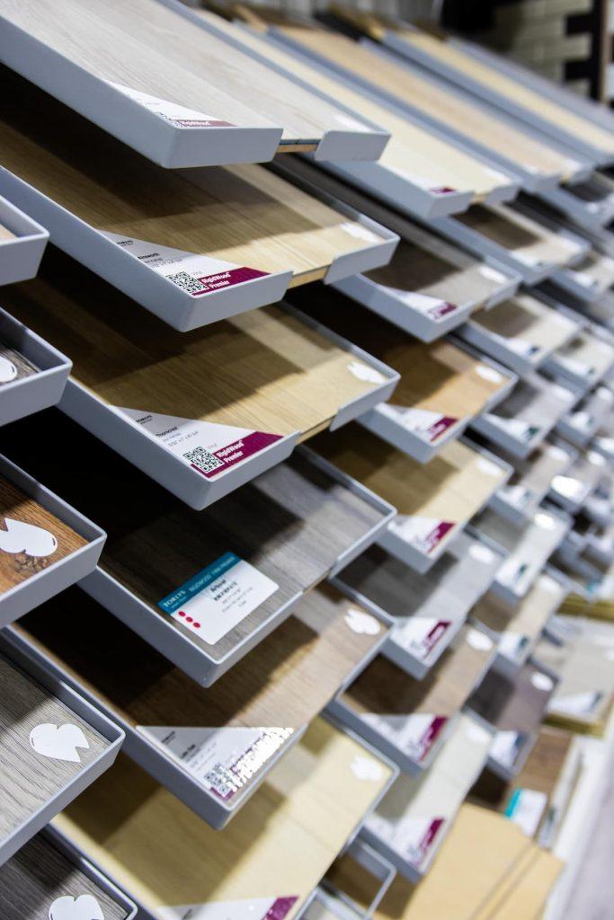 Flooring samples on racks at the Harmony Basements design centre
