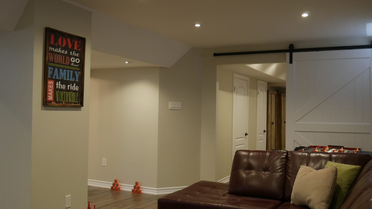 Basement barn door in Nobleton &mdash; a finished basement by Harmony Basements