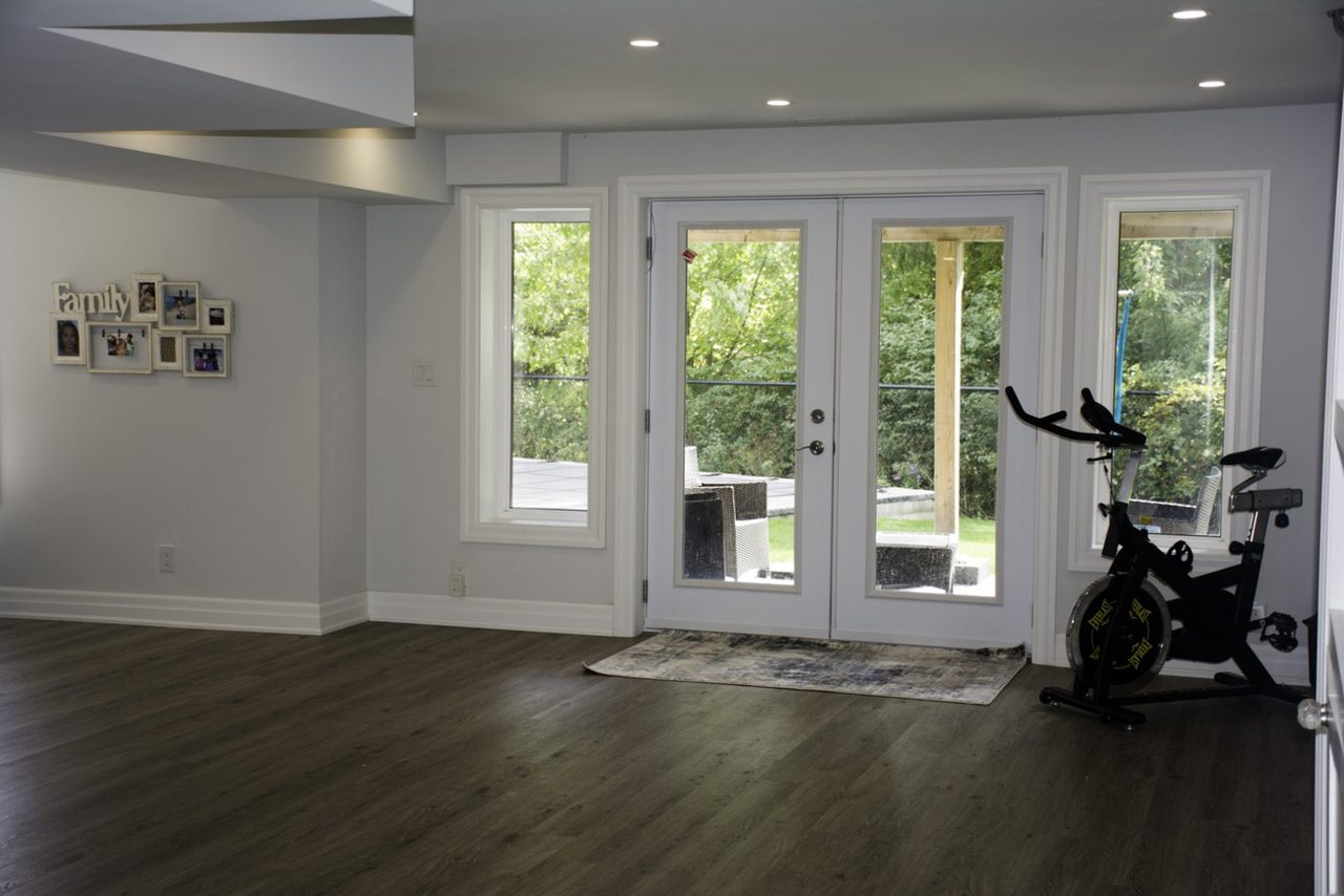Basement walkout ideas for Pickering: French doors out to the backyard &mdash; a walkout basement we built in Oakville